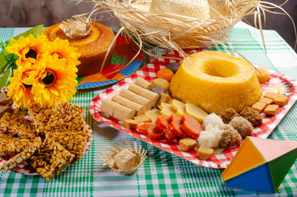 istock Festa Junina, beautiful rustic table with dishes containing various types of sweets for Festa Junina in Brazil, selective focus. 2159239735