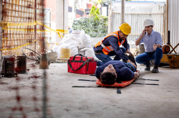 istock Safety team helping a builder having an accident at a construction site 2159239767