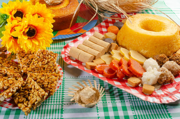 istock Festa Junina, beautiful rustic table with dishes containing various types of sweets for Festa Junina in Brazil, selective focus. 2159239782