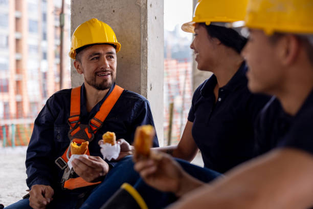 istock Building contractors taking a break from work and eating empanadas 2159239832