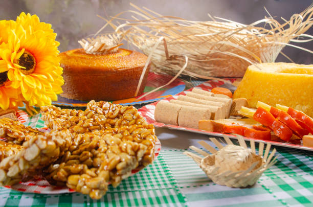 istock Festa Junina, beautiful rustic table with dishes containing various types of sweets for Festa Junina in Brazil, selective focus. 2159239903