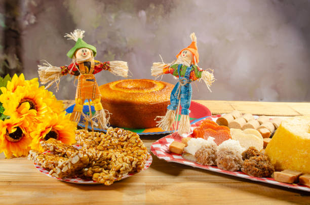 istock Festa Junina, beautiful rustic table with dishes containing various types of sweets for Festa Junina in Brazil, selective focus. 2159239904