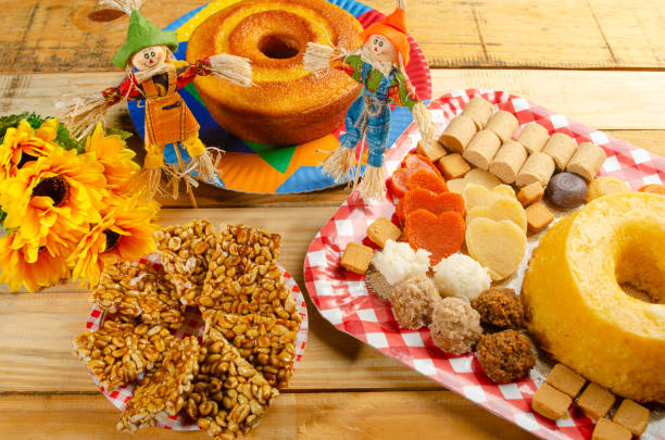 istock Festa Junina, beautiful rustic table with dishes containing various types of sweets for Festa Junina in Brazil, selective focus. 2159239907