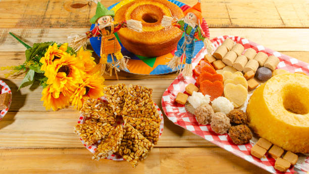 istock Festa Junina, beautiful rustic table with dishes containing various types of sweets for Festa Junina in Brazil, selective focus. 2159239909