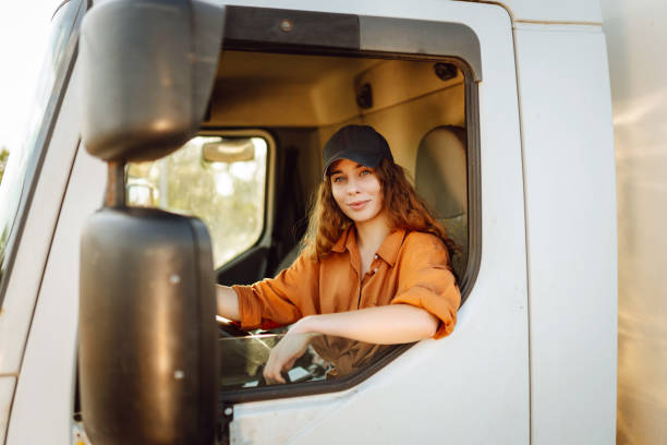 istock Young woman driving truck. 2159248558