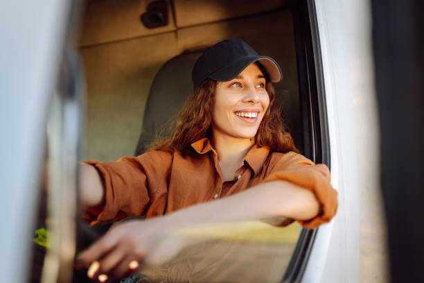 istock Young woman driving truck. 2159248561