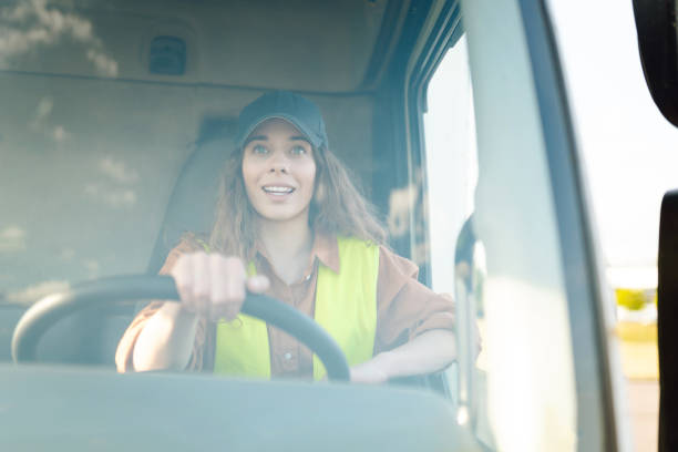 istock Young woman driving truck. 2159248573