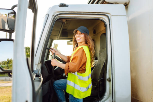 istock Young woman driving truck. 2159248580
