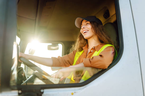 istock Young woman driving truck. 2159248590