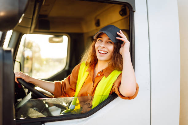 istock Young woman driving truck. 2159248595