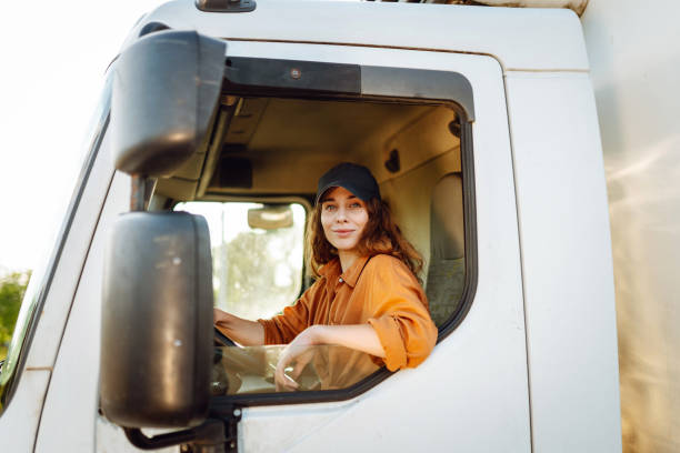 istock Young woman driving truck. 2159248599