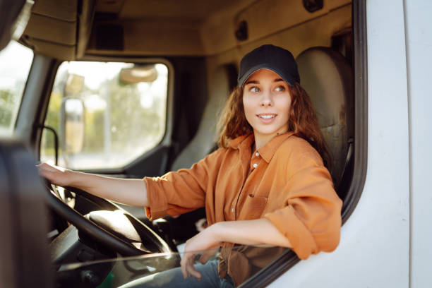 istock Young woman driving truck. 2159248935