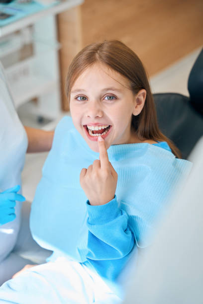 istock Child shows his teeth at the reception at the dentist 2159249277