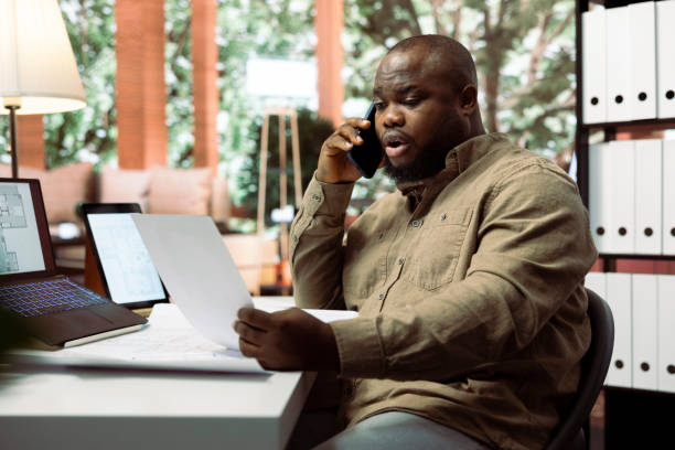 istock Professional businessman collaborating with contractors on phone call 2159250804