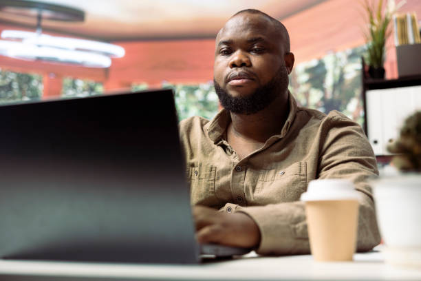 istock Business owner looks into project development online from his home office setup 2159251865