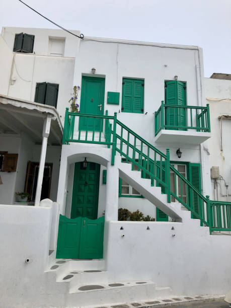 istock Santorini Greece home with green doors and rails 2159252184