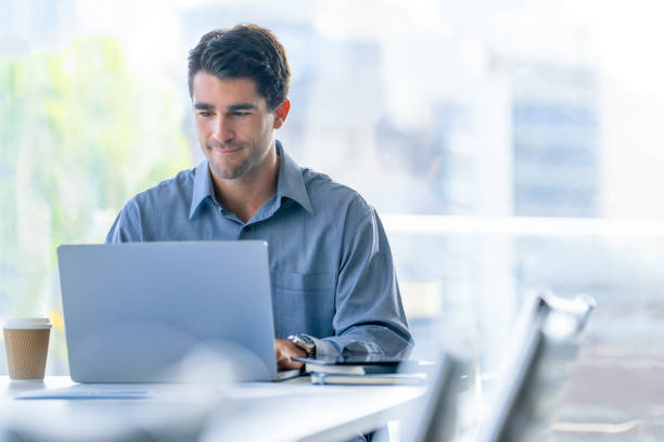 istock Serious Businessman working on a laptop computer in the office 2159252838