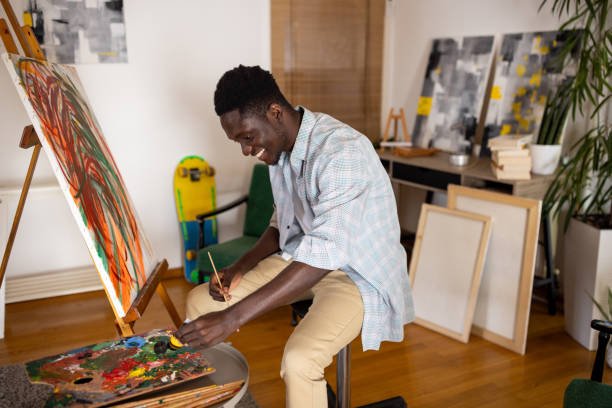 Male artist mixing colors