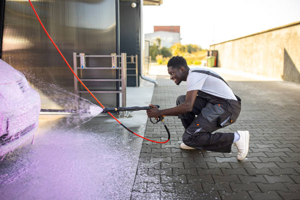 istock Worker Washing Car at Outdoor Service Station 2159258068