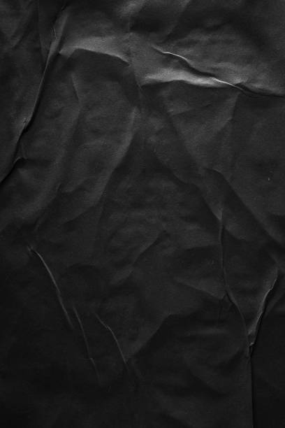 istock Vertical black crumpled paper poster texture background 2159259537