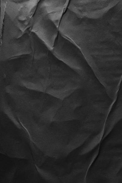 istock Vertical black crumpled paper poster texture background 2159259539