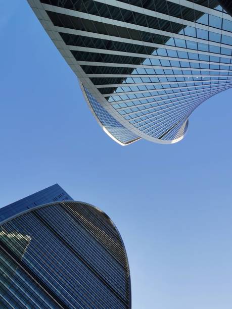 istock Two Tall Buildings Against Blue Sky 2159261308
