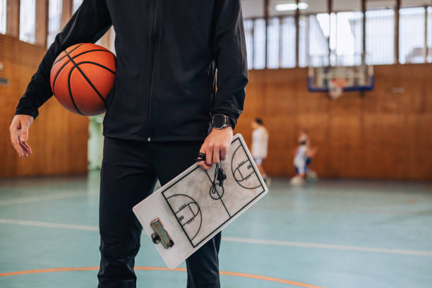 istock Coach with basketball and strategy board 2159261499