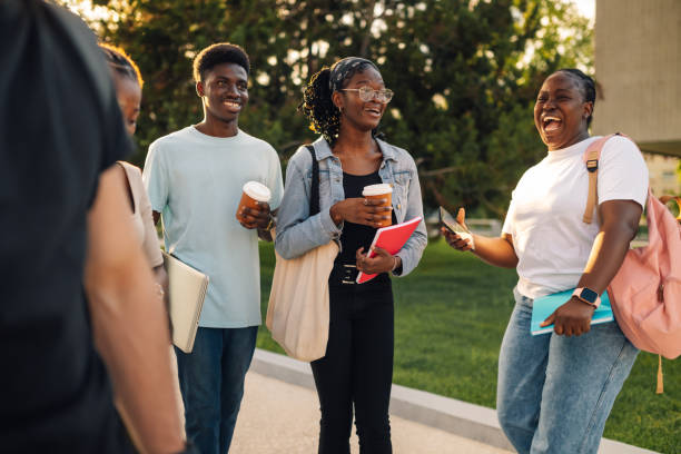 istock Interracial students walking at campus, laughing and having fun together 2159261528