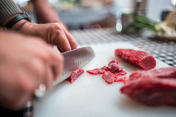 Close-up of skillfully preparing ingredients for a flavorful beef stir-fry delight on a cooking class.