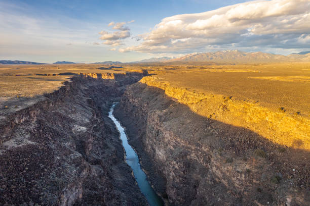 TAOS, NEW MEXICO - MAY 15, 2019: Rafters enjoy floating along the Rio Grande River near Taos, New Mexico. The Rio Grande is one of the principal rivers in the southwest United States and northern Mexico, flowing from Colorado in the U.S. to the Gulf of Mexico.