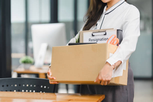 istock Employee Holding Box with Resignation Letter. 2159268086