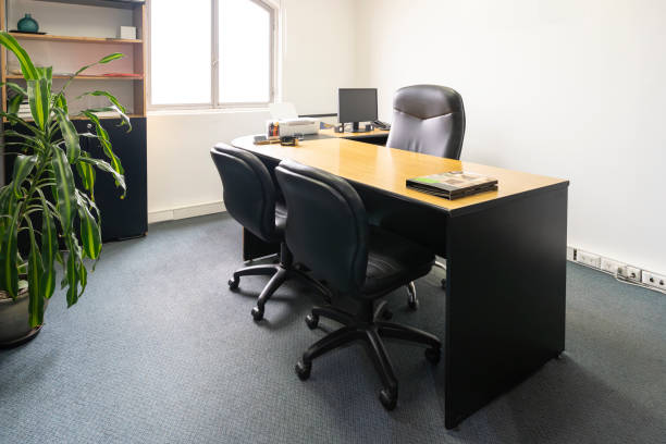 Empty office in a classic style with a desk and a window