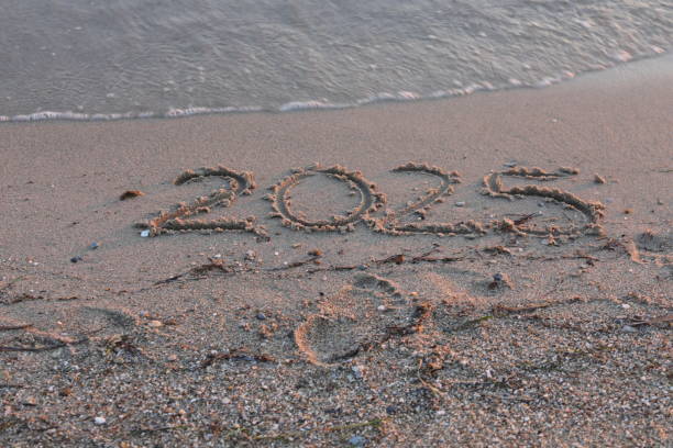 istock New Year 2025, lettering on the beach. 2159270386