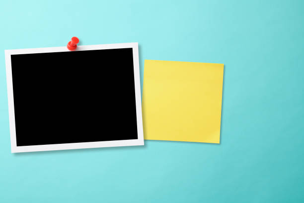 istock Pinned blank photo with thumbtack on light blue background with yellow sticky note 2159276819