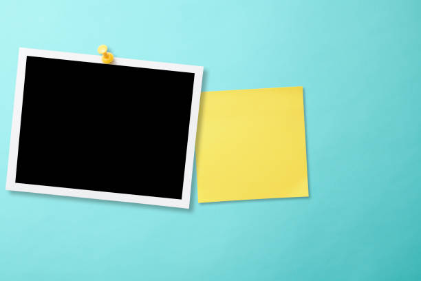 istock Pinned blank photo with thumbtack on light blue background with yellow sticky note 2159276820