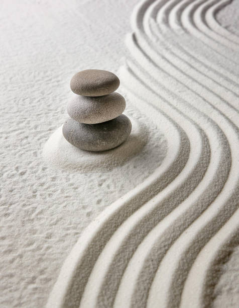Zen garden with the stones and white sand pattern minimal scene Stack of Balanced Pebbles, zen pebbles, relax, massage, meditation, studio photography