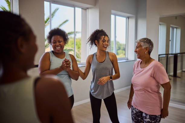 istock Young female dance coach laughing with diverse students after class in studio 2159279008
