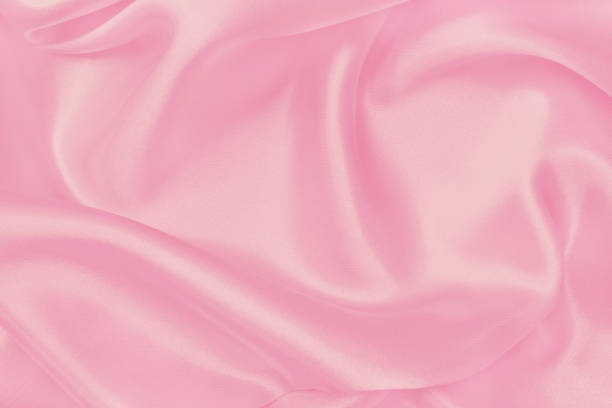 istock Soft pink fabric texture background, detail of silk or linen pattern. 2159284889