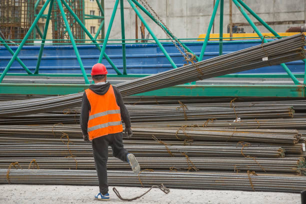 Workers carrying wood