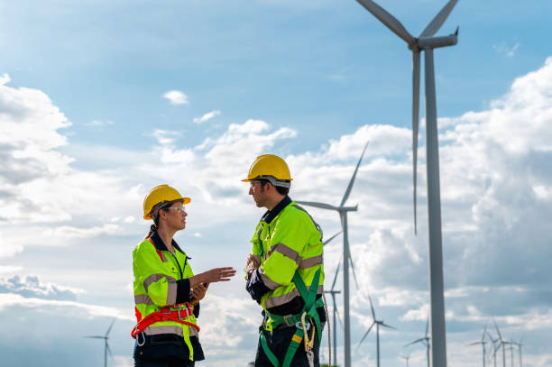istock Two men in safety gear are talking to each other 2159286802