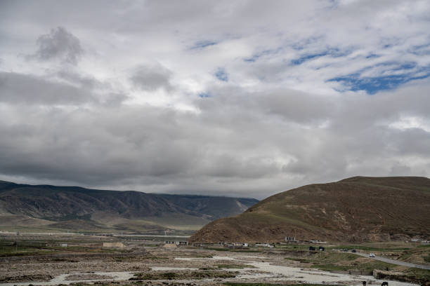 istock Cloudy weather, mountains and green fields on the plateau 2159288473