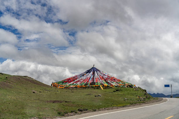 Tibetan prayer flags on the hillside on the plateau