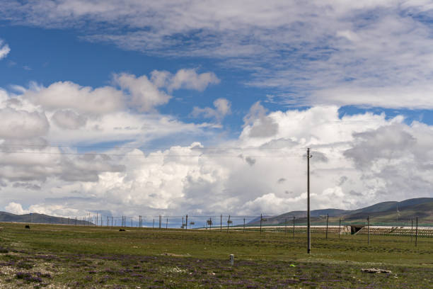 Cloudy weather, mountains and green fields on the plateau