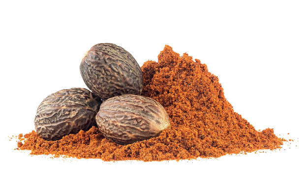 istock Ground nutmeg and group of whole nutmegs isolated on a white background 2159288558