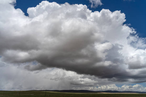 Clouds, meadow and mountains on the plateau