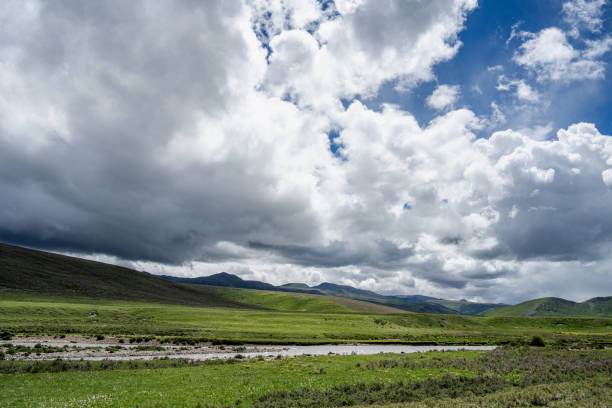 Cloudy weather, meadows, rivers and mountains on the plateau