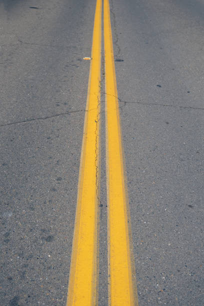 istock Double yellow line on the road 2159289663