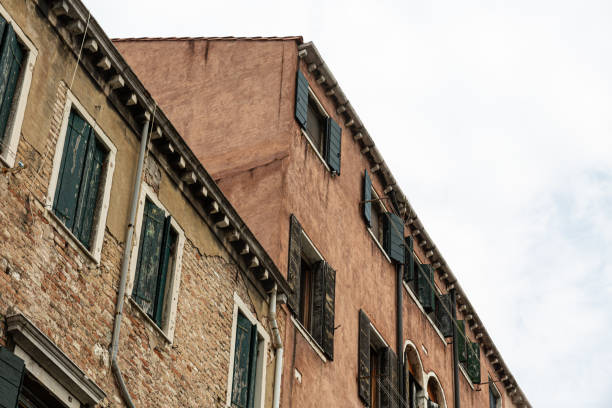 Photo of Venice, Italy. Typical urban view with houses on the bank of the channel