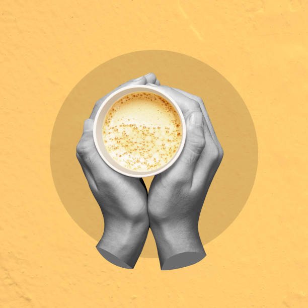 istock A hand holding a cup of coffee with steam rising from it 2159292402