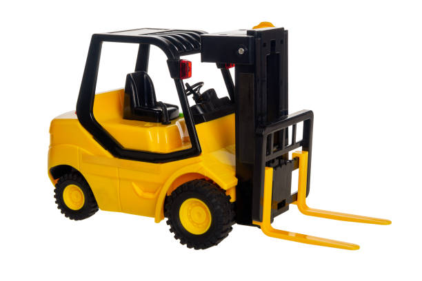Fork lift, plastic toy transport machine with lifting load for children, isolated on white background, close up